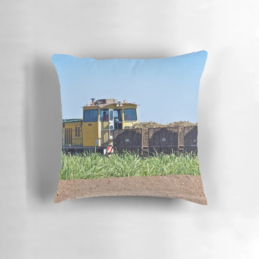 A cozy pillow featuring a cane train design, perfect for capturing the essence of Ayr, North Queensland.