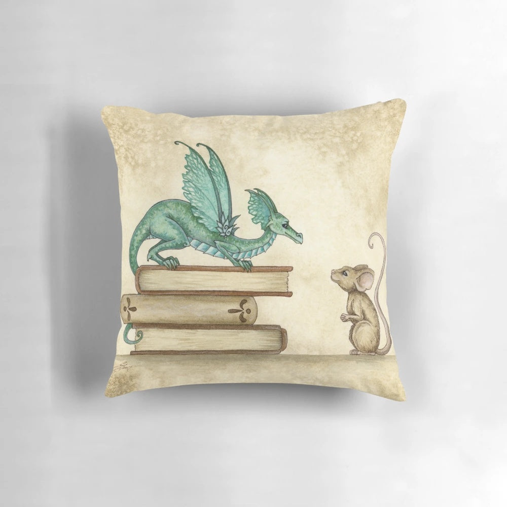 A whimsical fantasy pillow featuring a dragon and mouse in a cozy library setting