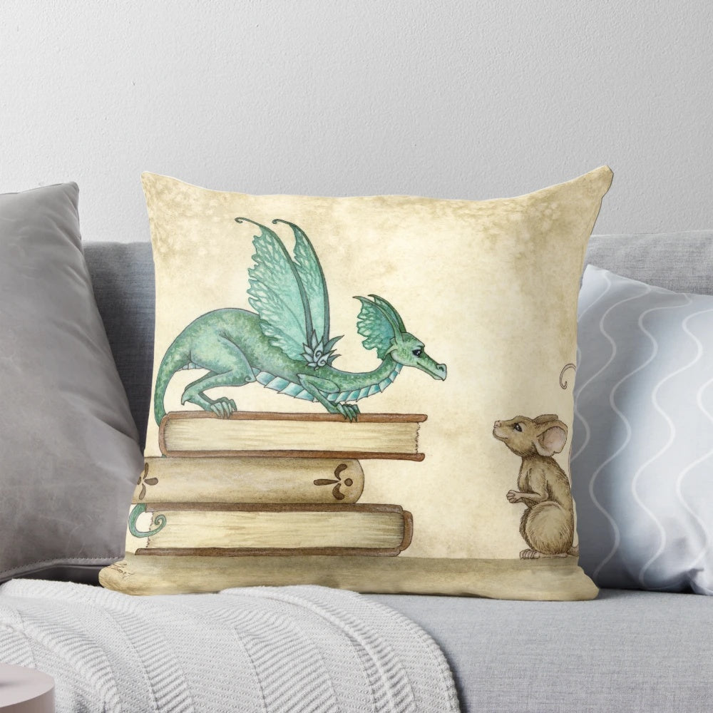 A whimsical fantasy pillow featuring a dragon and mouse in a cozy library setting