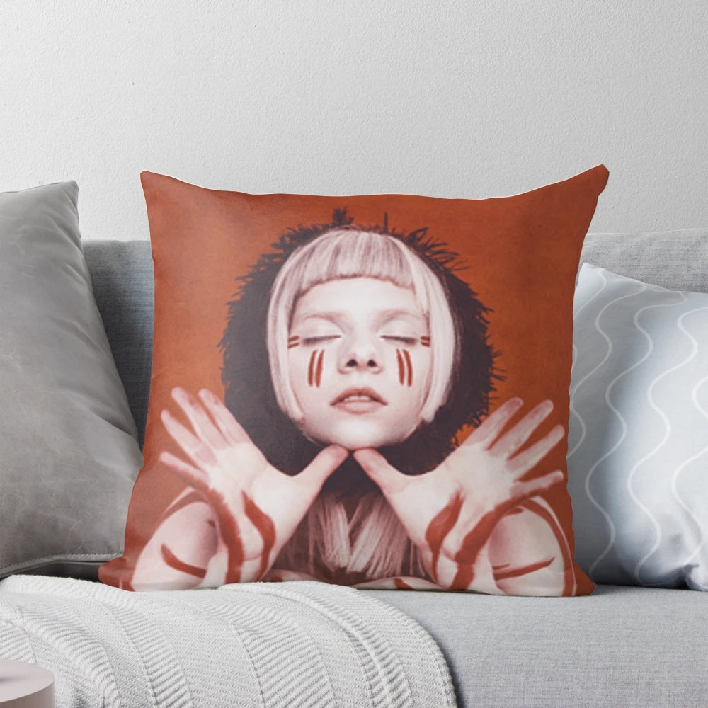 Aurora Aksnes, a Norwegian indie and queer music artist, featured on a soft and comfortable pillow.