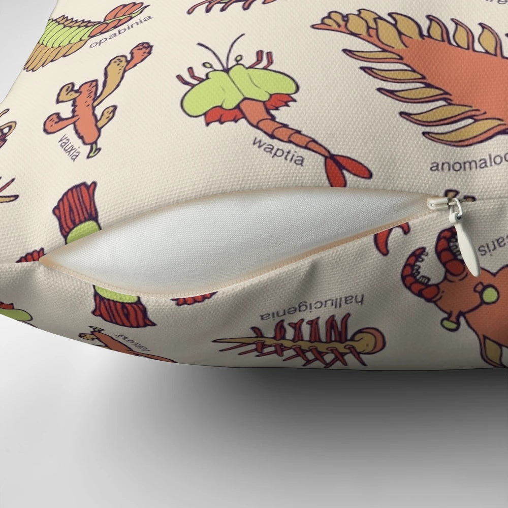 Colorful throw pillow featuring an infographic-style illustration of various Cambrian period invertebrate fossils