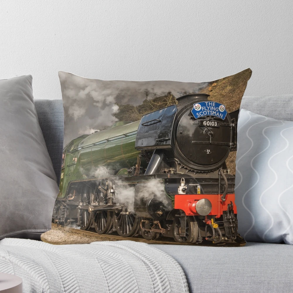 The iconic green steam locomotive, the Flying Scotsman, a famous British train known for its speed and record-breaking achievements.