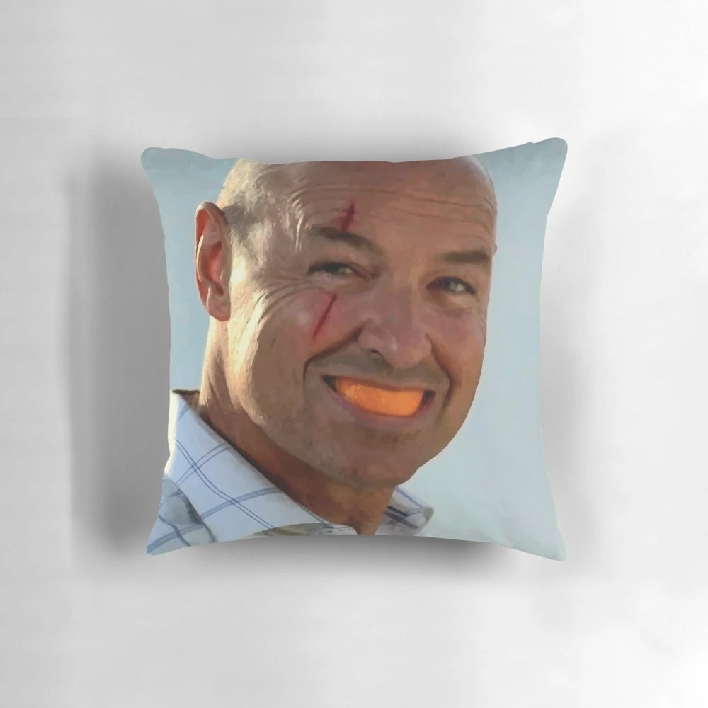 An orange slice-shaped pillow featuring the iconic character John Locke from the TV series Lost.