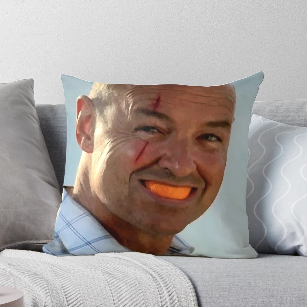 An orange slice-shaped pillow featuring the iconic character John Locke from the TV series Lost.