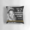 A colorful throw pillow featuring a nature-inspired design and an uplifting quote from Maya Angelou.