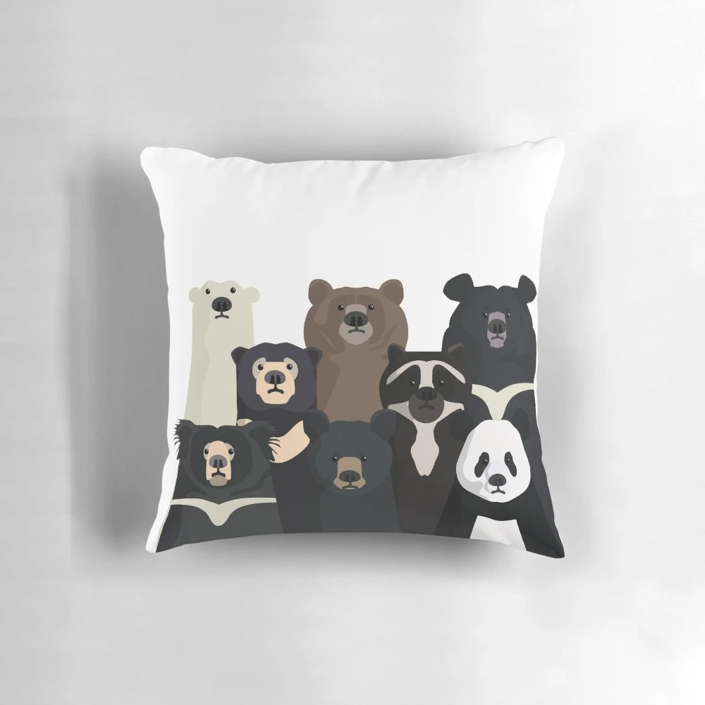 A cozy pillow featuring a collection of bear species from around the world, including polar bears, pandas, grizzlies, and more.