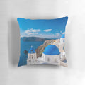 Santorini Greece Pillow featuring a stunning view of the iconic white-washed buildings and blue-domed churches