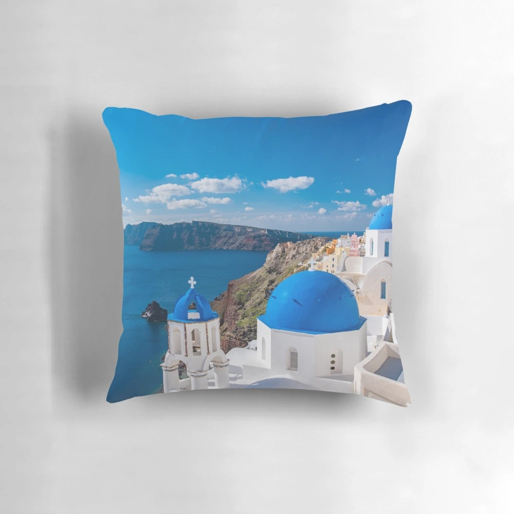 Santorini Greece Pillow featuring a stunning view of the iconic white-washed buildings and blue-domed churches