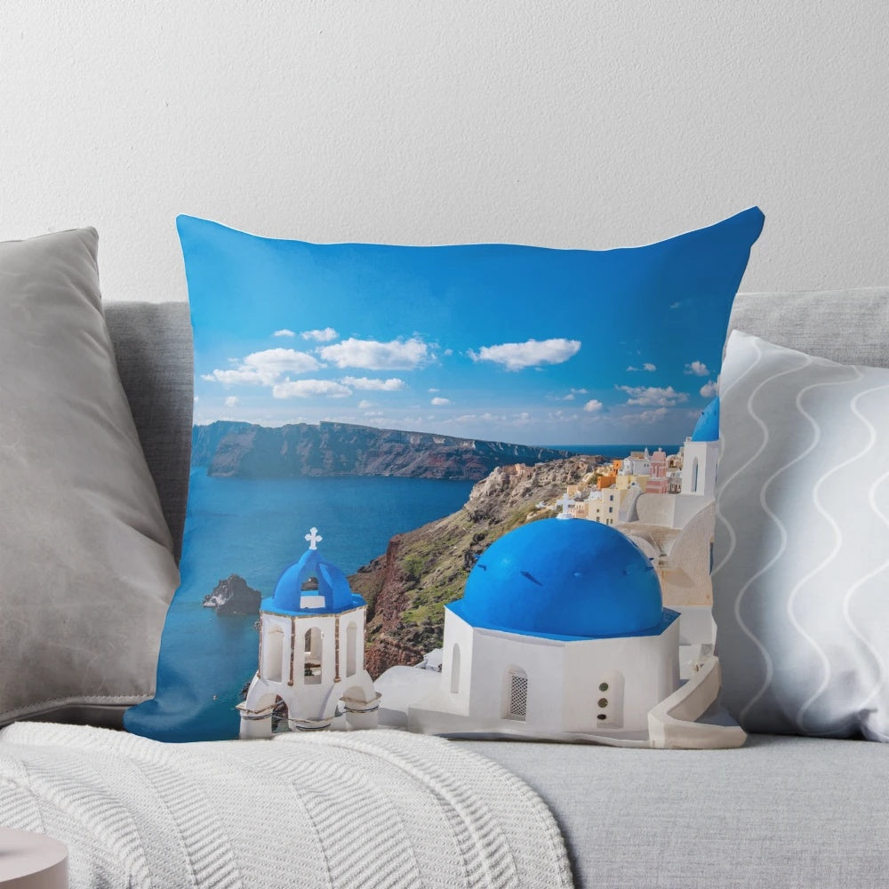 Santorini Greece Pillow featuring a stunning view of the iconic white-washed buildings and blue-domed churches