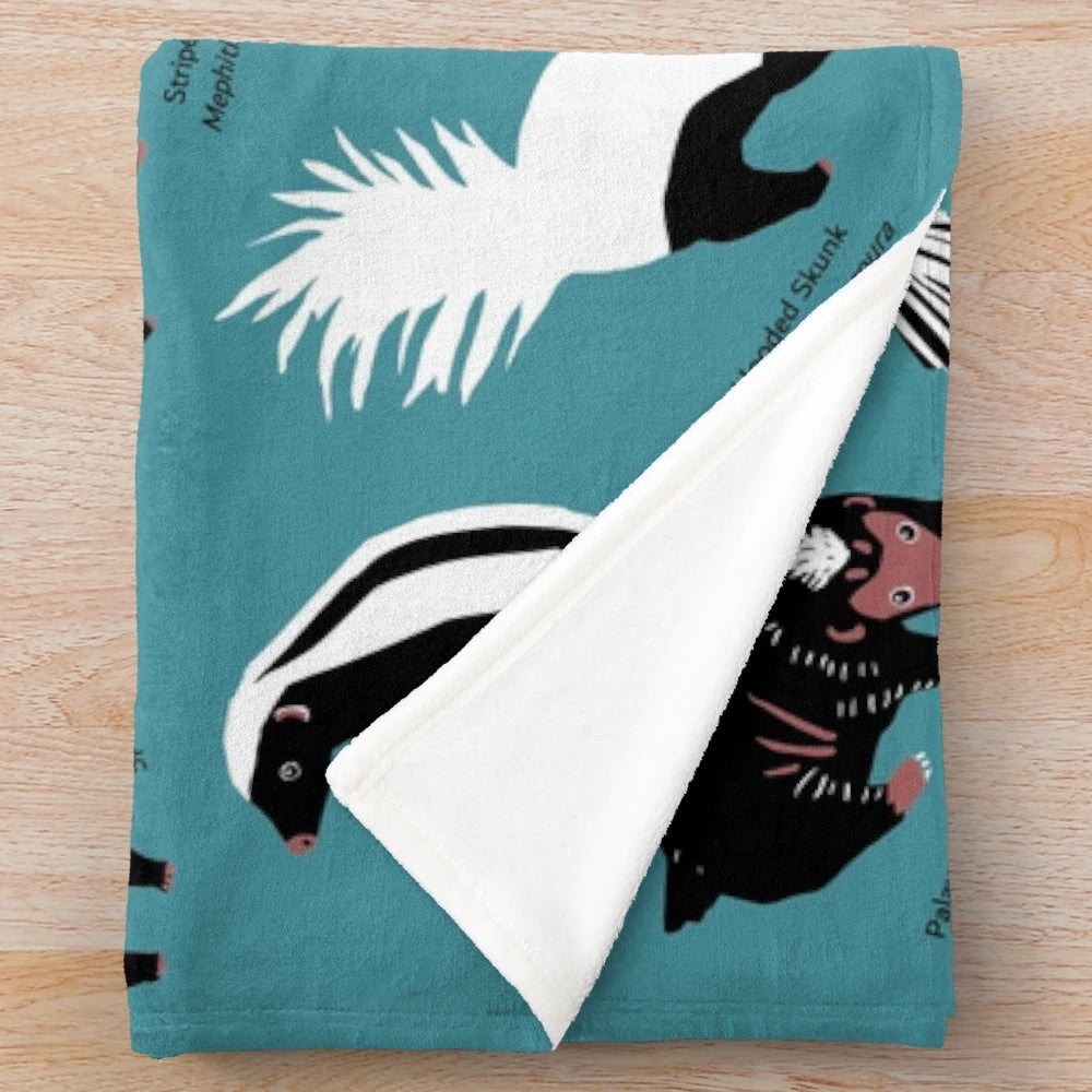 Plush blanket featuring various skunk species from the Mephitidae family