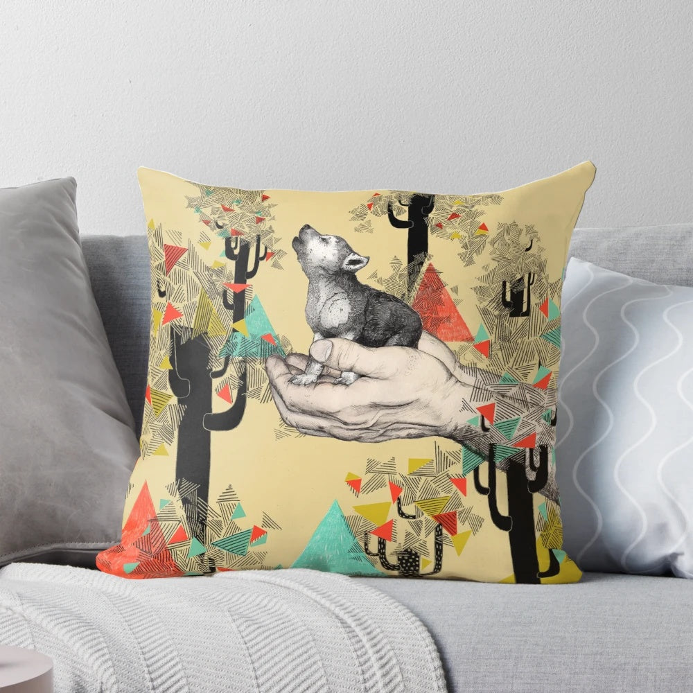 A cozy pillow featuring a whimsical wolf cub design in yellow and mustard tones surrounded by geometric shapes and trees.
