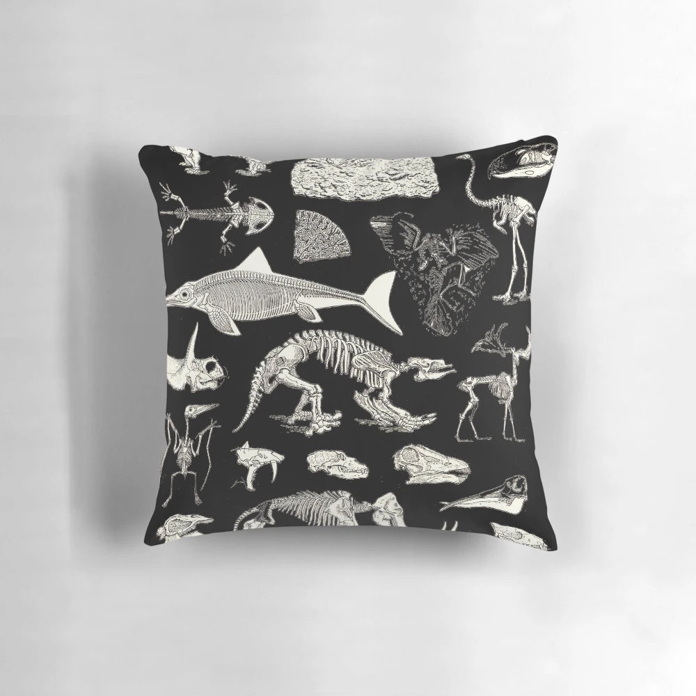 Paleontology illustration pillow featuring fossils, dinosaur bones, and ancient artifacts