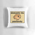 Beige frog pillow with speckled patterns, showcasing a message to dismantle the patriarchy.