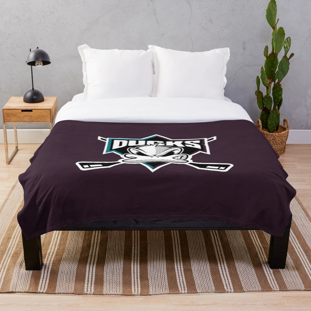Disney-inspired Mighty Ducks plush blanket featuring the hockey team's logo and colors