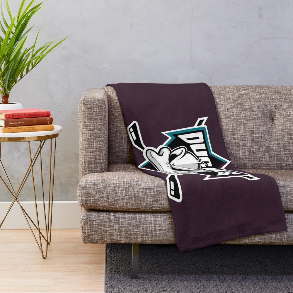 Disney-inspired Mighty Ducks plush blanket featuring the hockey team's logo and colors