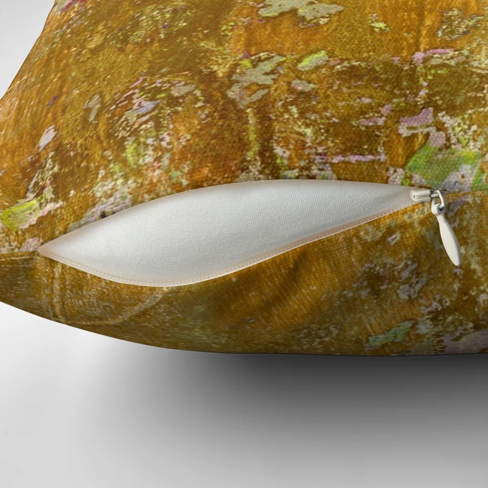 Worn, abstract pattern pillow in ochre and yellow colors with a distressed, aged texture.