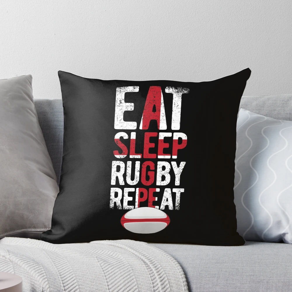 A distressed vintage-style rugby pillow with the England flag and "Eat Sleep Rugby Repeat" design.