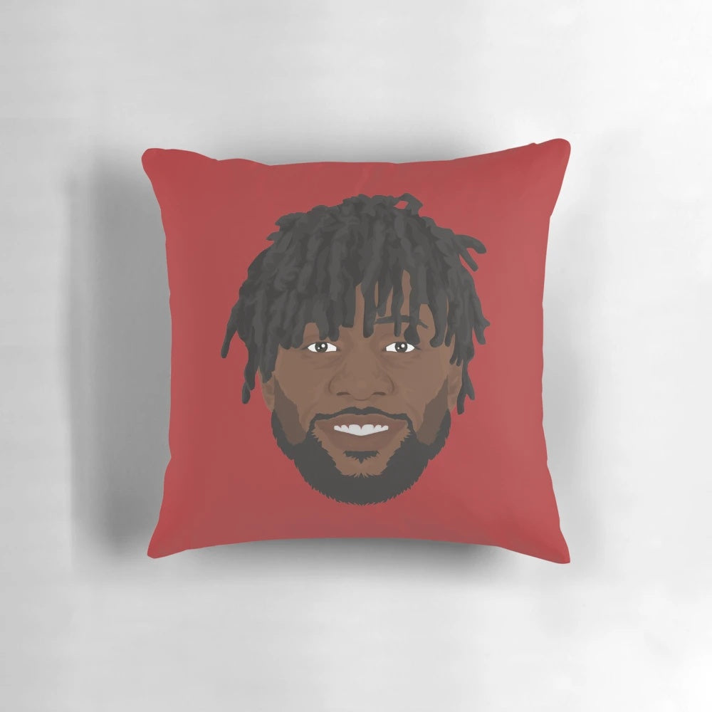 Divock Origi, a professional soccer player, featured on a decorative pillow with his portrait.