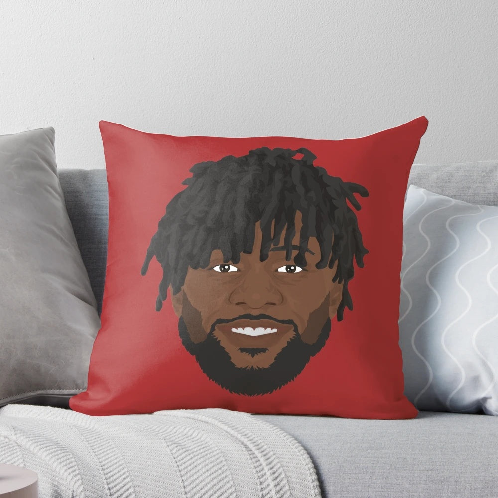 Divock Origi, a professional soccer player, featured on a decorative pillow with his portrait.
