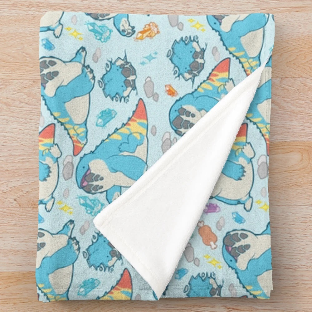 Dodogama-inspired plush blanket in pastel blue color featuring the monster hunter world character