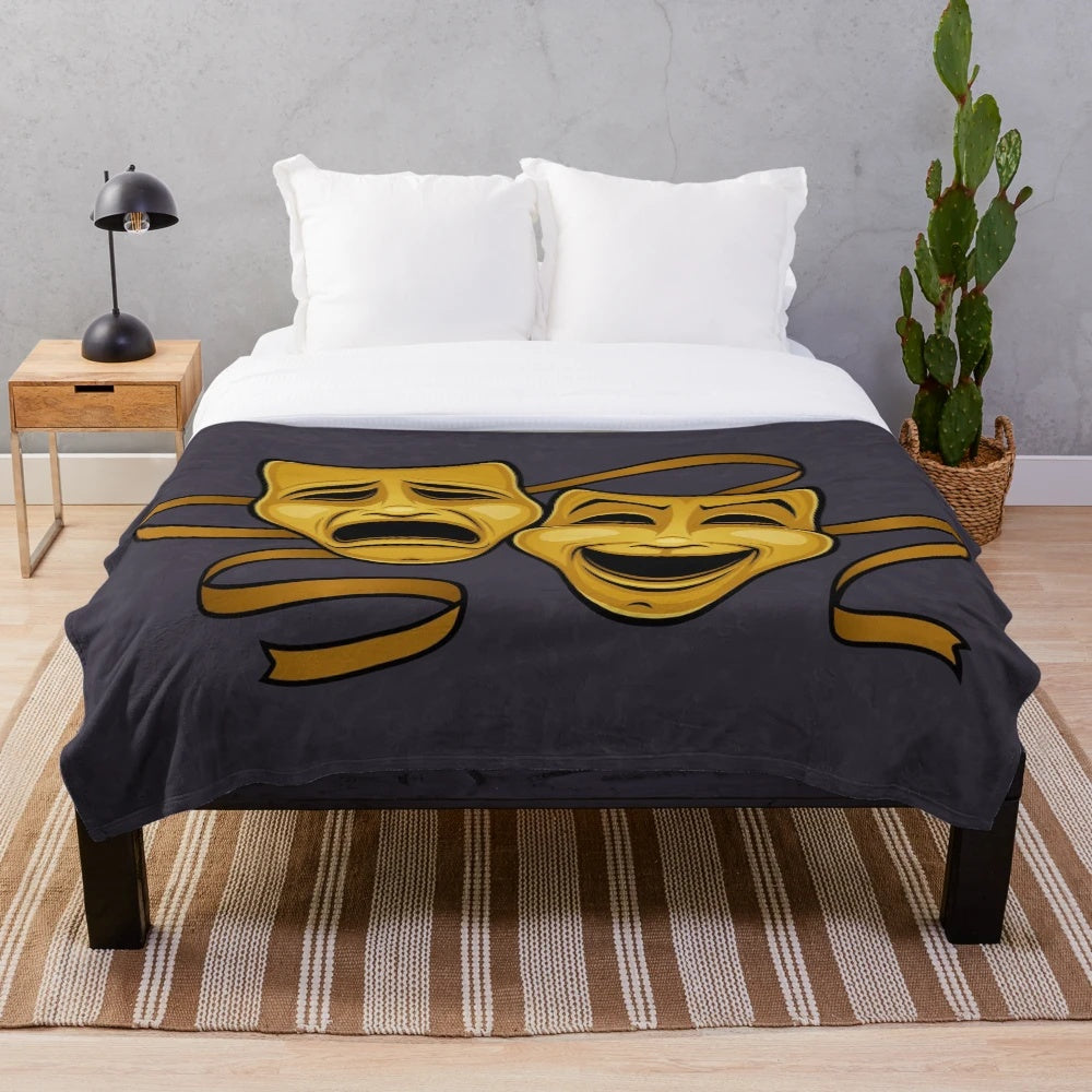 Plush blanket featuring gold comedy and tragedy theater masks
