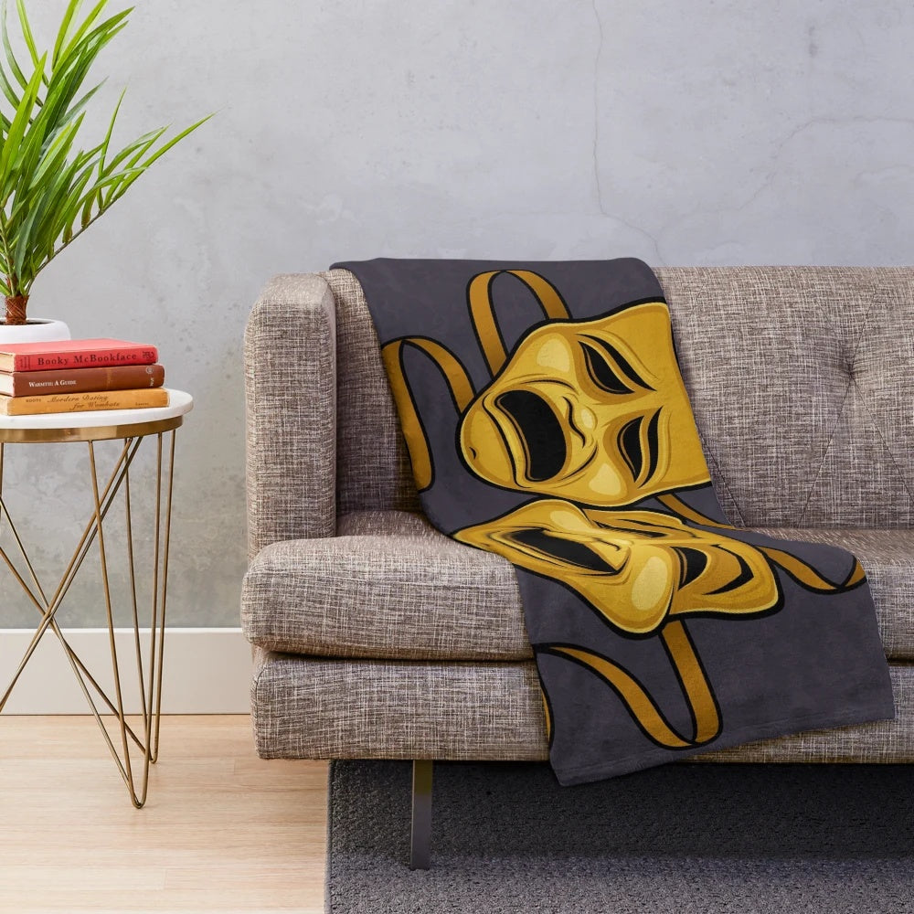 Plush blanket featuring gold comedy and tragedy theater masks