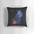 A soft, blue and orange pillow with a celestial design featuring a fox, stars, and the moon.