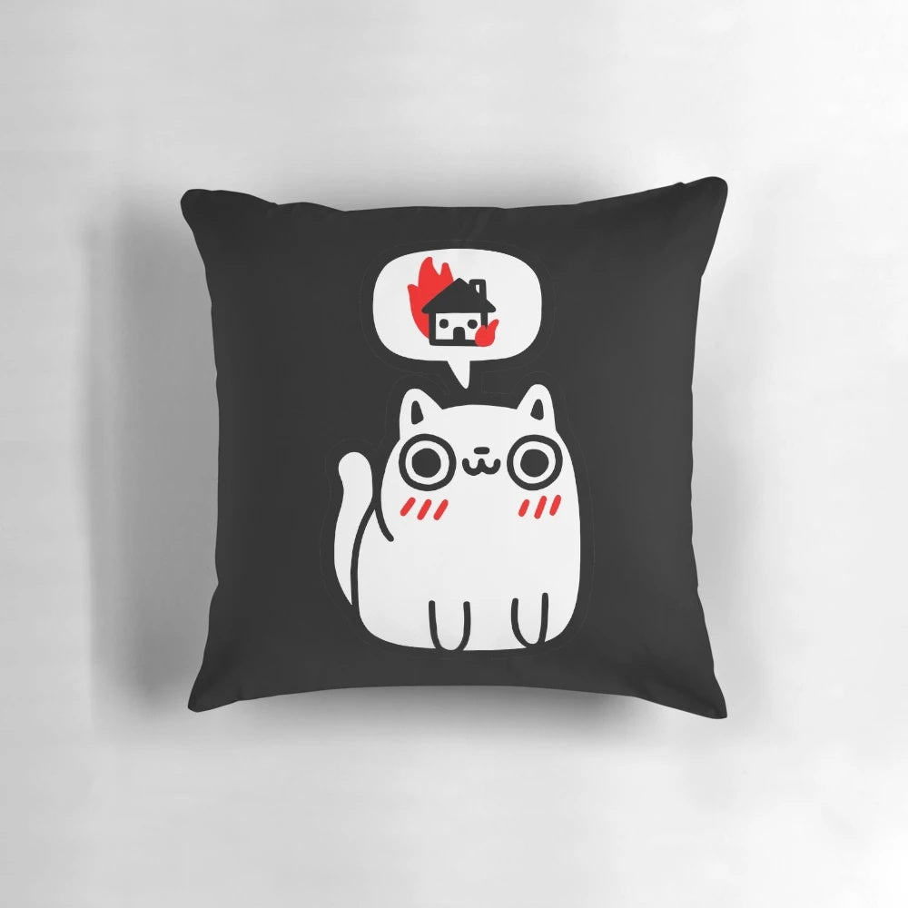 A white and black pillow with a cute cat graphic depicting an explosion or fire, perfect for adding a playful touch to any space.