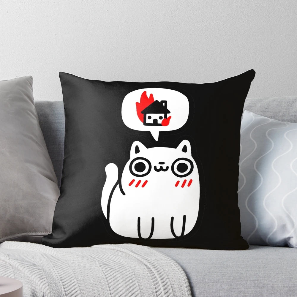 A white and black pillow with a cute cat graphic depicting an explosion or fire, perfect for adding a playful touch to any space.