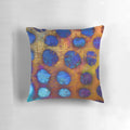 A dark and abstract decorative pillow with bubble-like patterns, perfect for modern home decor.
