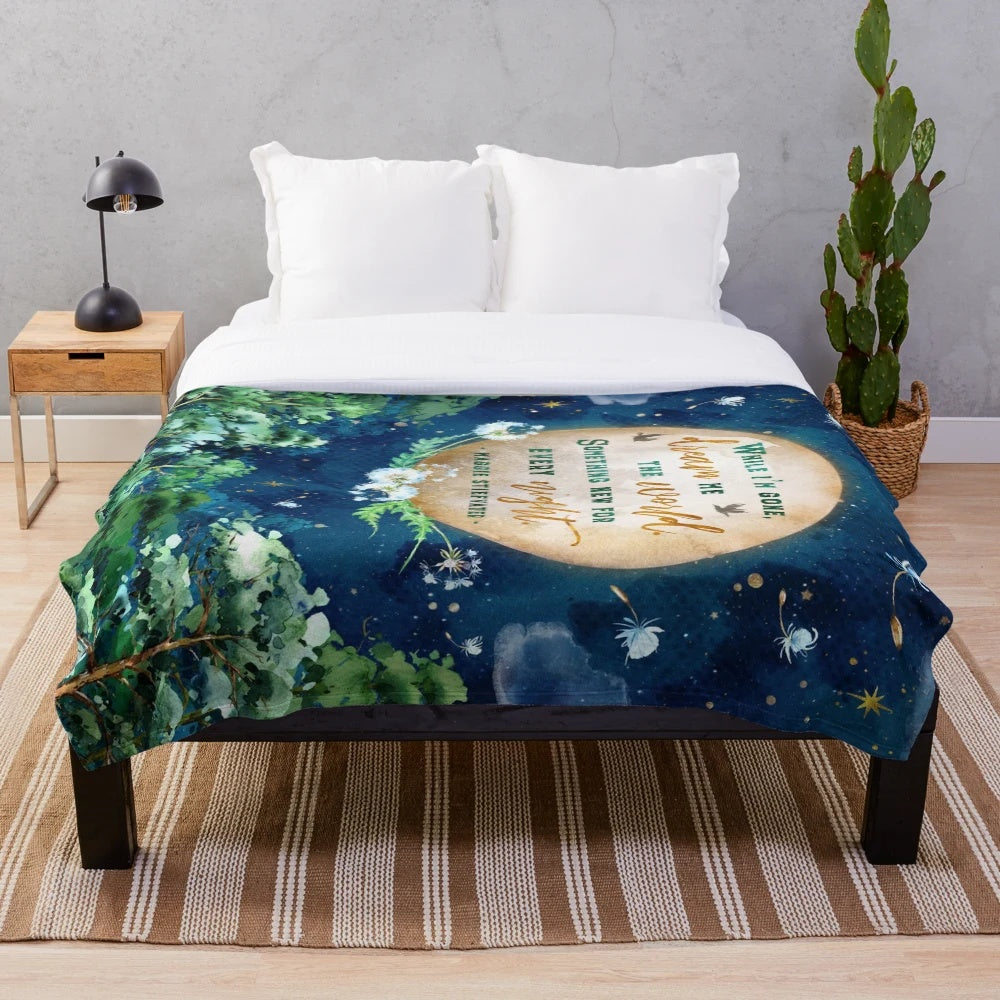 Dreamscape Plush Blanket featuring a watercolor design of a forest, moon, and stars