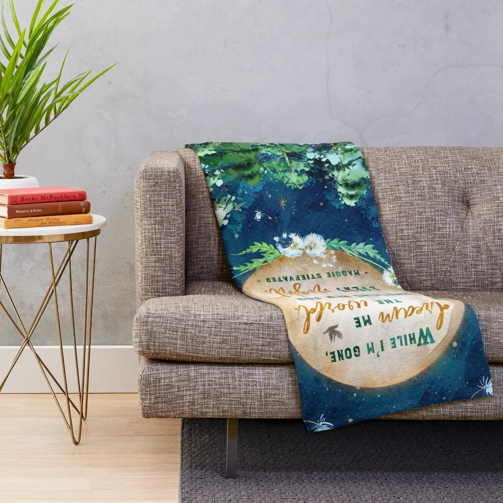 Dreamscape Plush Blanket featuring a watercolor design of a forest, moon, and stars