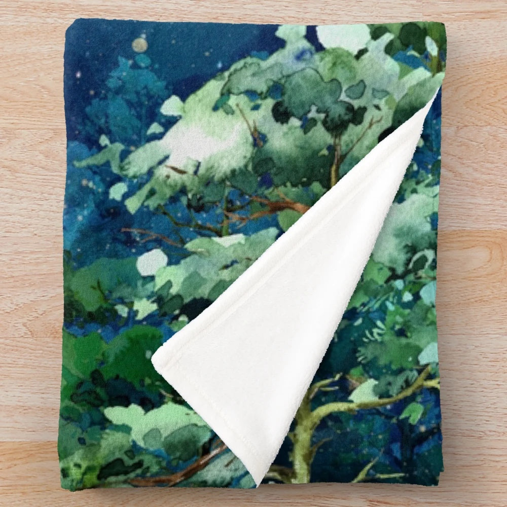 Dreamscape Plush Blanket featuring a watercolor design of a forest, moon, and stars