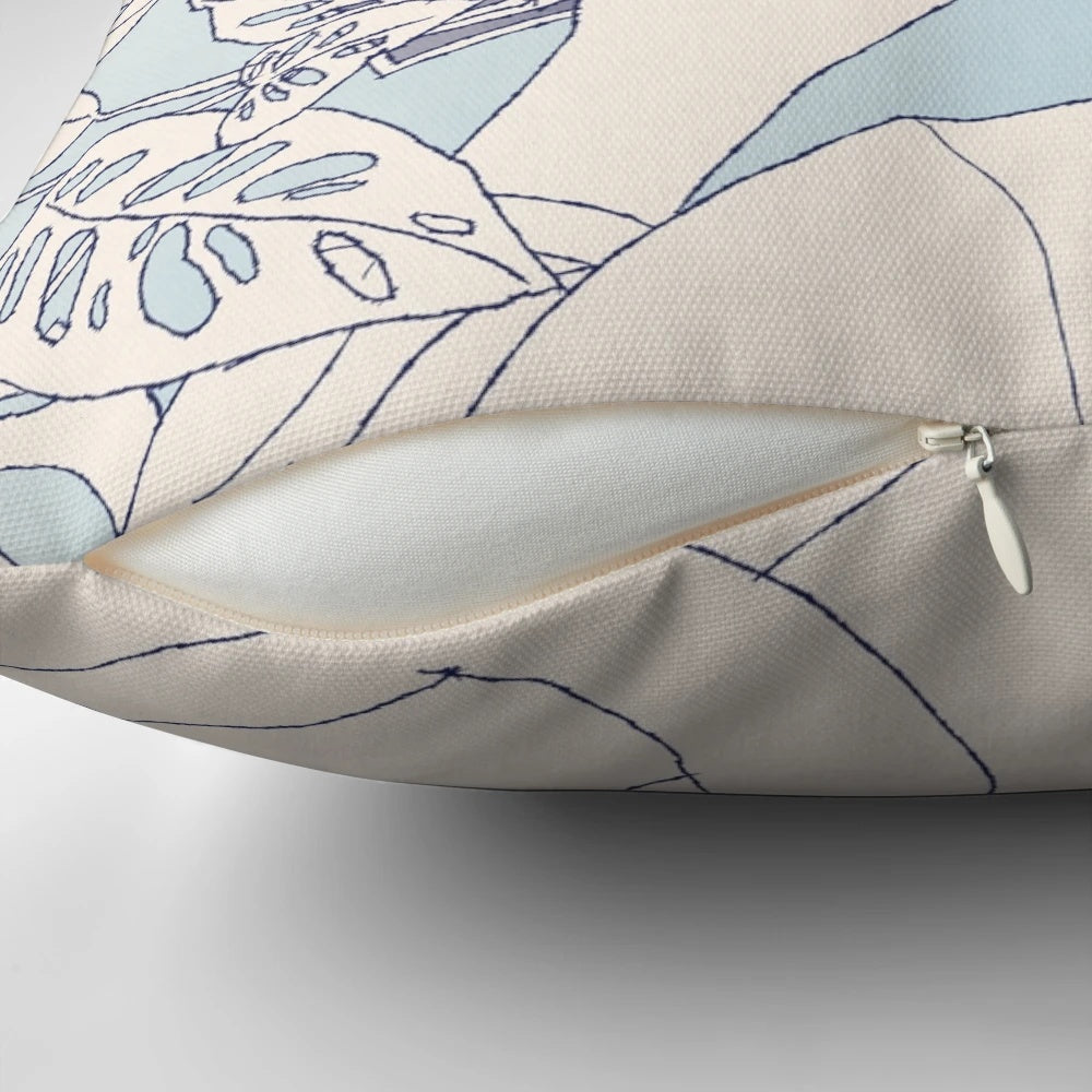 Closeup of a throw pillow with a tropical houseplant botanical illustration design.