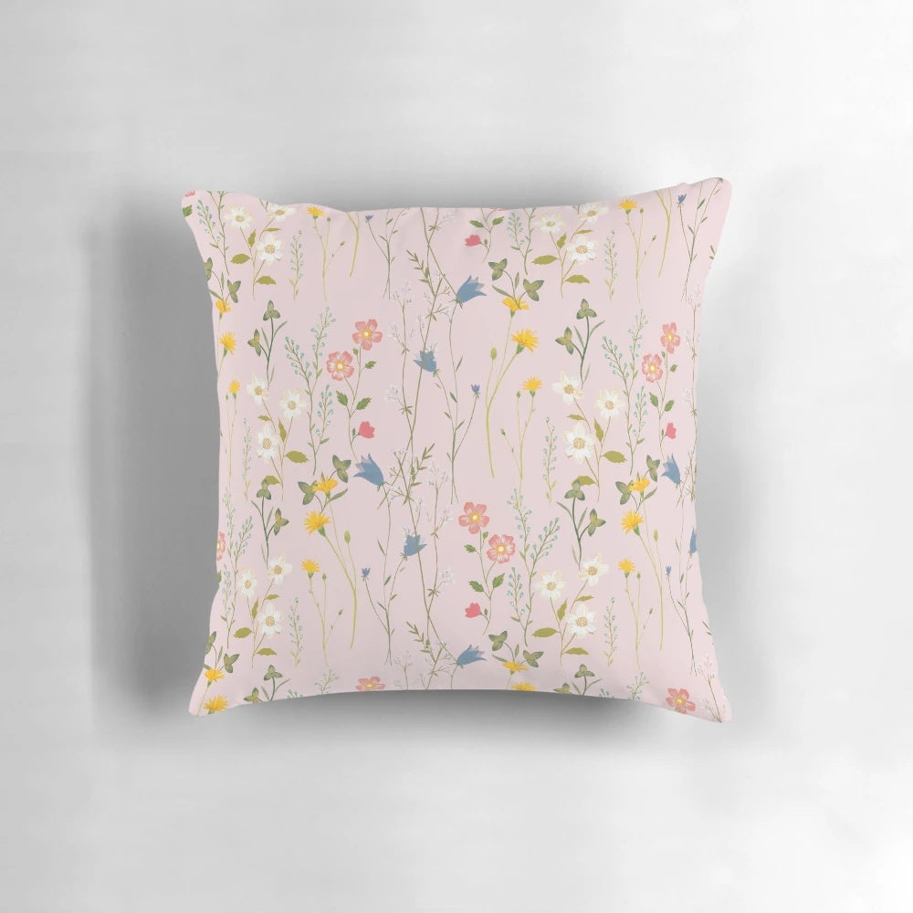 A soft, plush pillow featuring a beautiful floral pattern in vibrant colors, perfect for adding a touch of boho charm to your summer home decor.