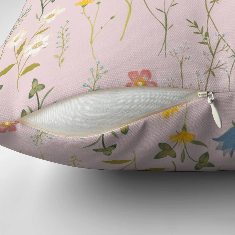 A soft, plush pillow featuring a beautiful floral pattern in vibrant colors, perfect for adding a touch of boho charm to your summer home decor.
