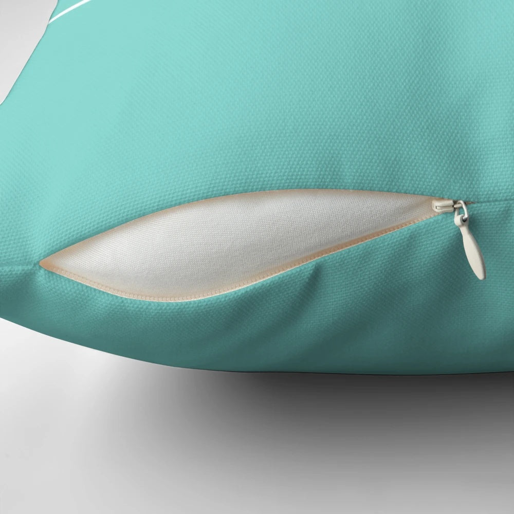 Two pink and teal pillows with a breakfast-themed design, featuring donuts, cakes, and Tiffany-style branding.