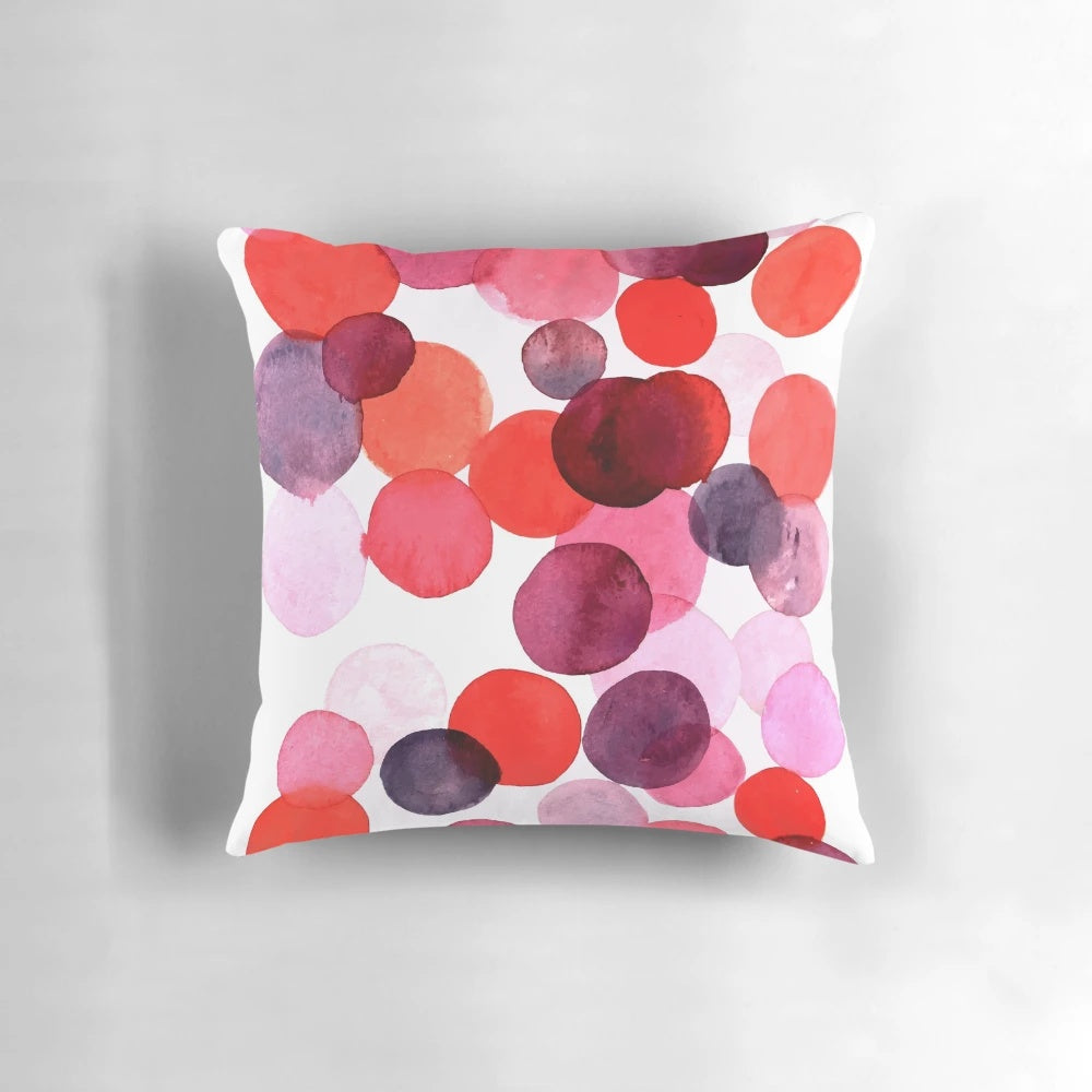 Colorful bubble print pillow with pink, purple, and peach tones