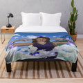Plush blanket with whimsical cloud and celestial pattern design