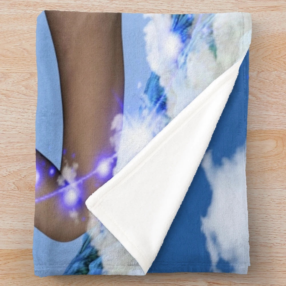Plush blanket with whimsical cloud and celestial pattern design
