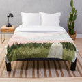 Soft, cozy plush blanket with a dreamy cotton candy sky design