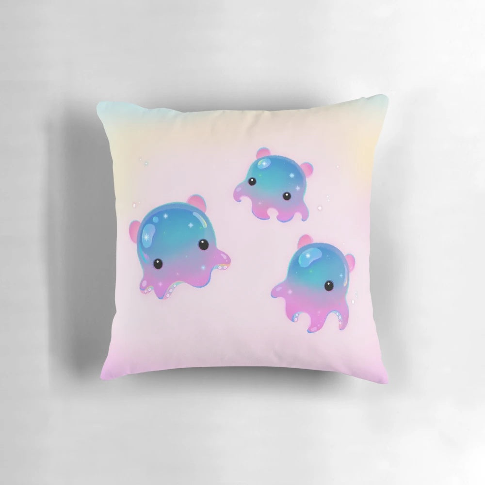 A plush pillow featuring a whimsical illustration of a Dumbo Octopus (Grimpoteuthis), a deep-sea cephalopod known for its distinctive ear-like fins.