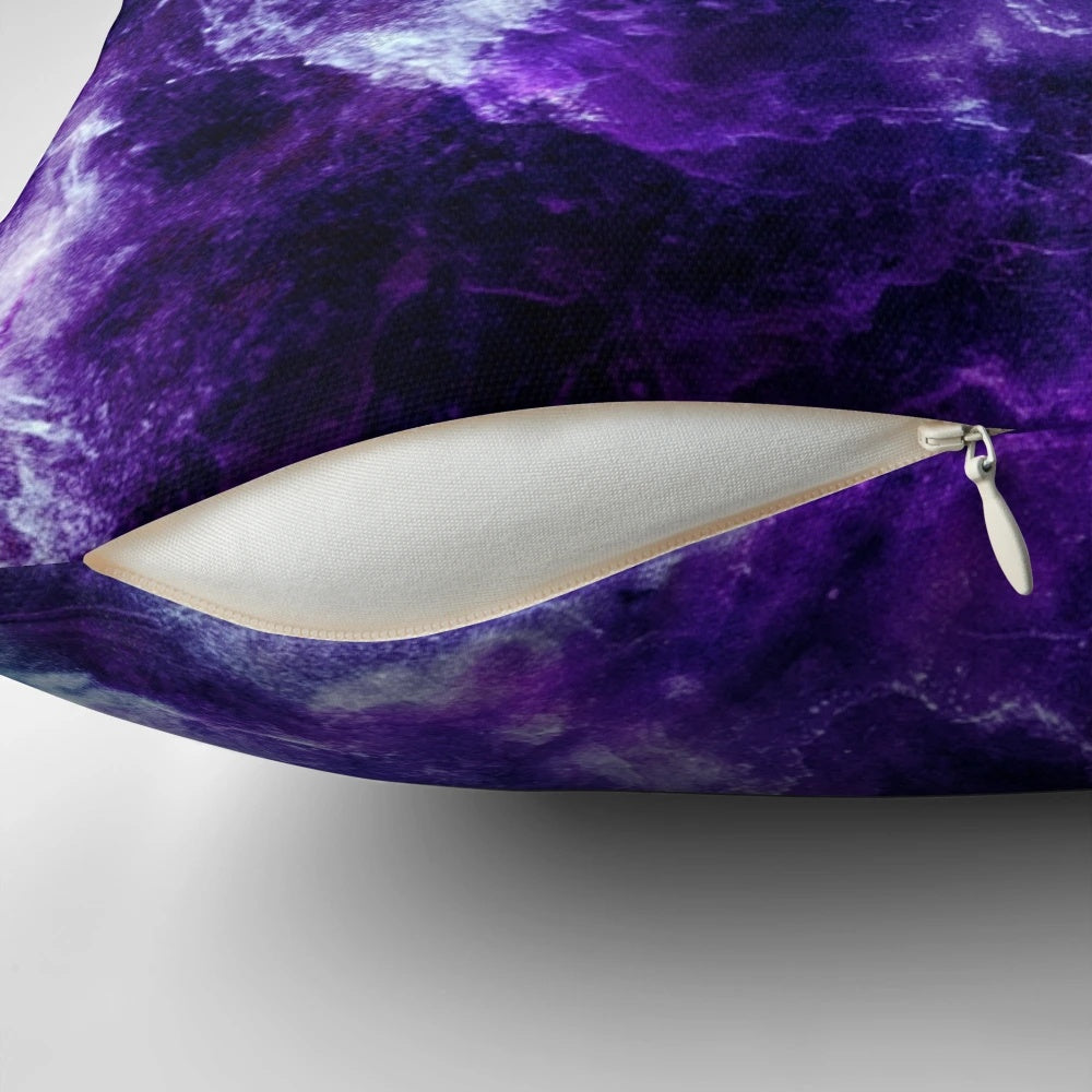 A plush, decorative pillow featuring a captivating galaxy nebula and marble print design in shades of purple and teal.