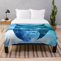 Plush moon mask pattern blanket with abstract, nature-inspired design