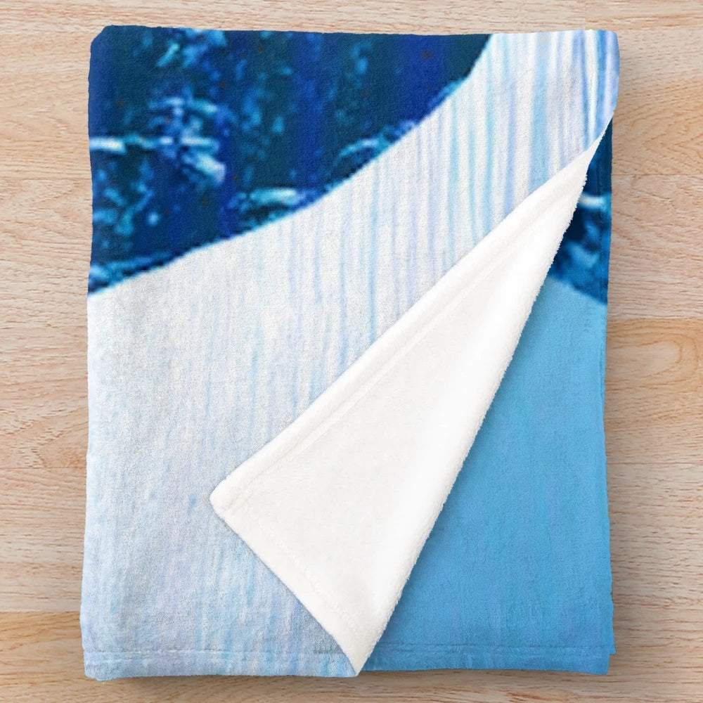 Plush moon mask pattern blanket with abstract, nature-inspired design