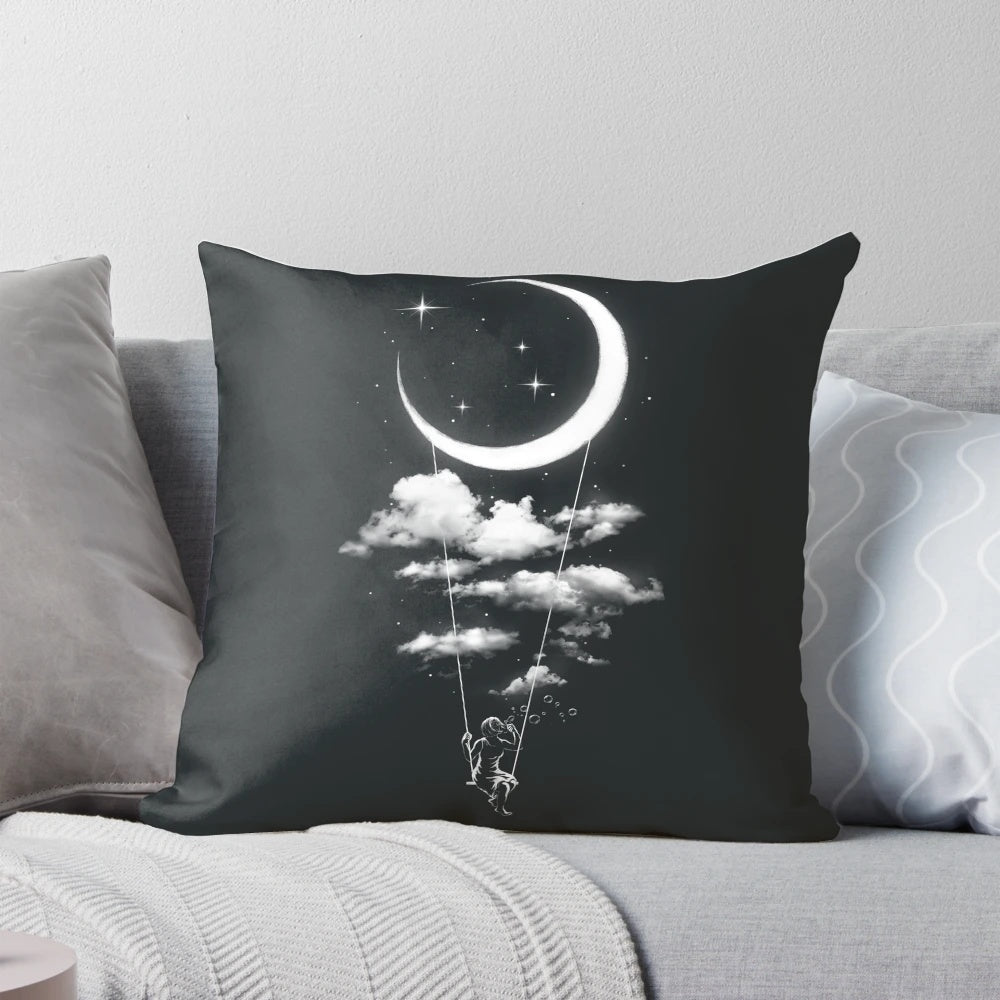 Soft, plush moon-shaped pillow swinging on a metal frame against a starry night sky backdrop