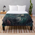 Plush blanket featuring a design of mythical sea creatures