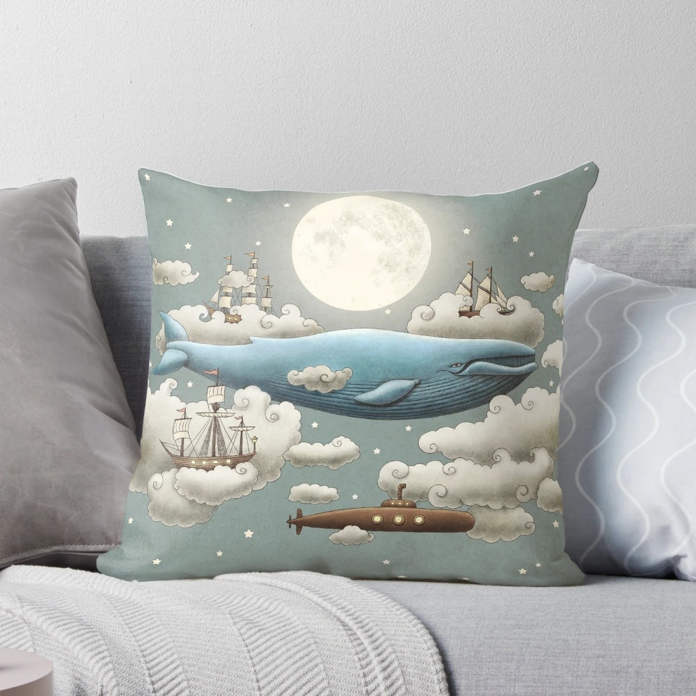Ocean themed pillow featuring a blue whale, tall ships, and a cloudy sky