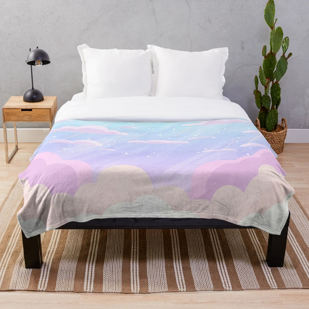 Pastel-colored plush blanket with cloud and star design