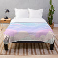 Pastel-colored plush blanket with cloud and star design
